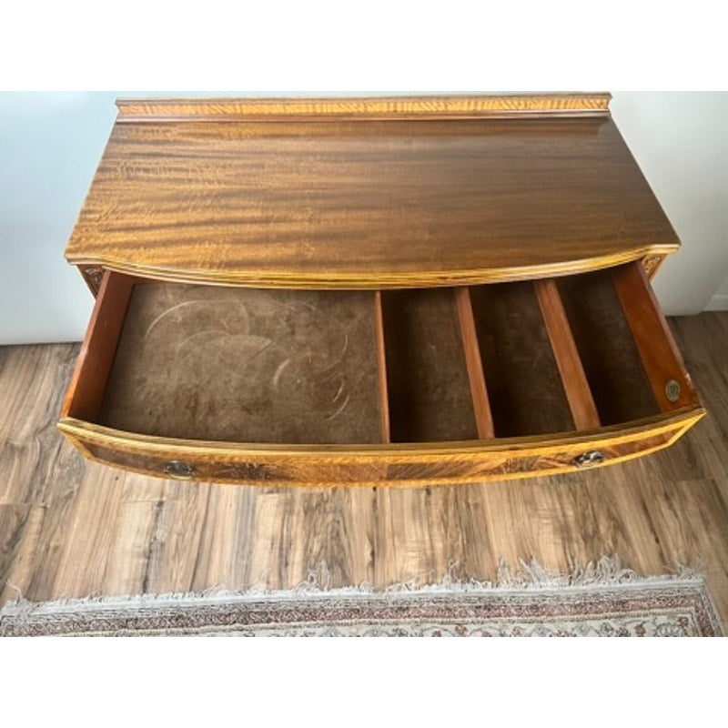 A Vintage Federal Style Bow Front Mahogany Sideboard by Paine Furniture Boston features an open top drawer with four dark brown velvet-lined compartments, shown on a wooden floor beside a patterned rug.