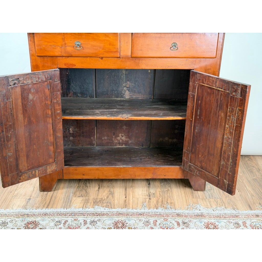 A Pennsylvania or Mid-Atlantic Cherry Open Pewter Cupboard, circa 1800–1830, featuring two drawers above an open storage cabinet with two hinged doors.