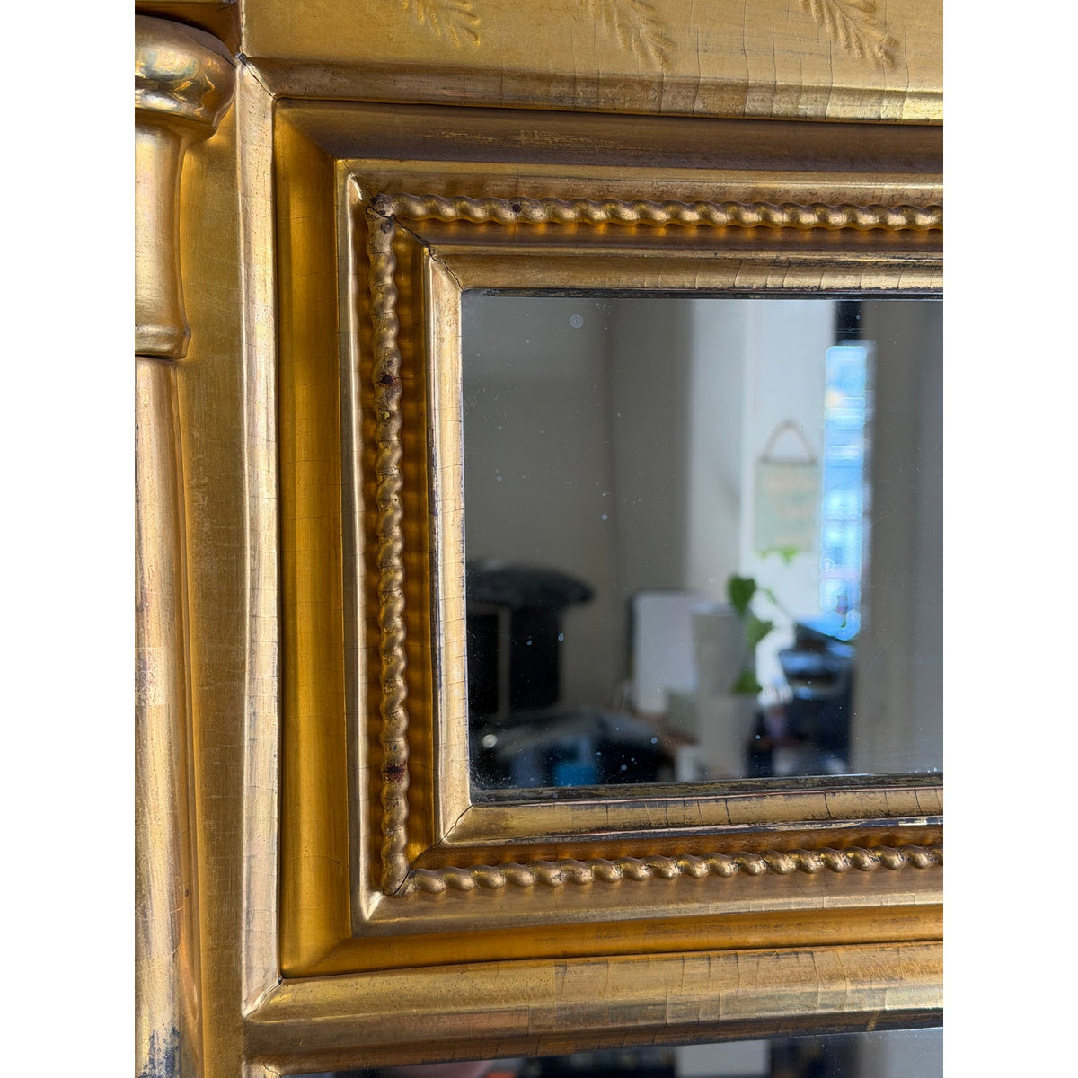 A detail shot of an American Federal Giltwood Two-Plate Looking Glass, Probably Massachusetts, circa 1810–1830, featuring a rectangular giltwood frame with a beaded inner border.