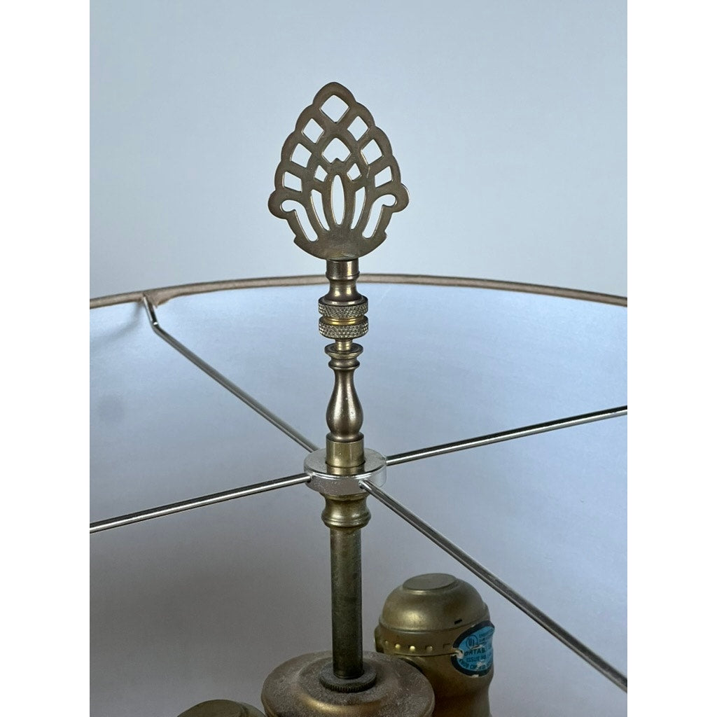 A close-up of the decorative finial atop a Vintage Japanese Cloisonné Cylinder Table Lamp by Knob Creek, featuring a white lampshade and visible metal frame in the background.