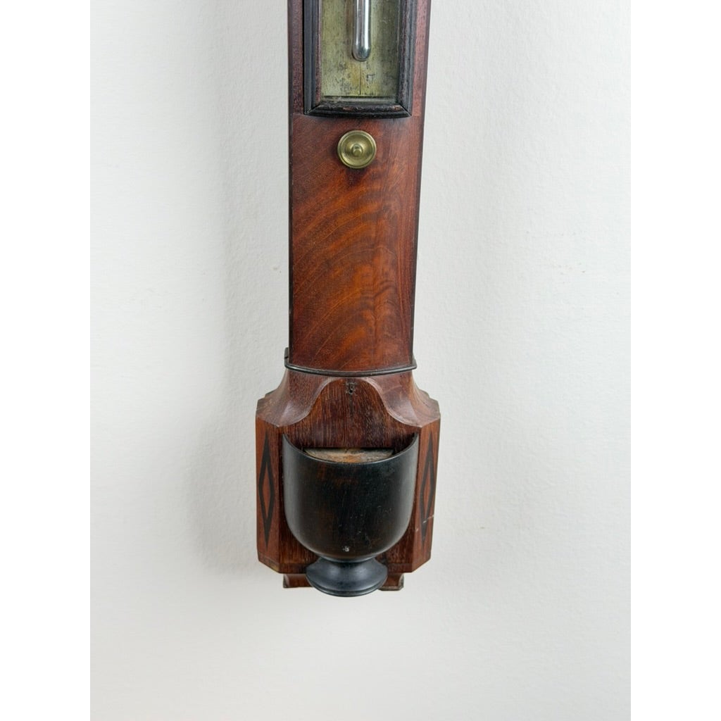 English Regency Mahogany Stick Barometer by Thomas Jones, Liverpool, c. 1820, featuring a brass adjustment knob and a dark bulbous cistern cover at the base.
