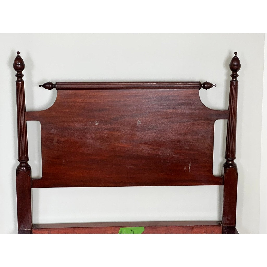 A Vintage Pair Centennial Solid Mahogany Twin Four Poster Beds c. 1940 showcases carved posts with finials, a rectangular central panel, and a polished dark finish, echoing Federal Sheraton antique style. Part of the bed frame is seen at the bottom.