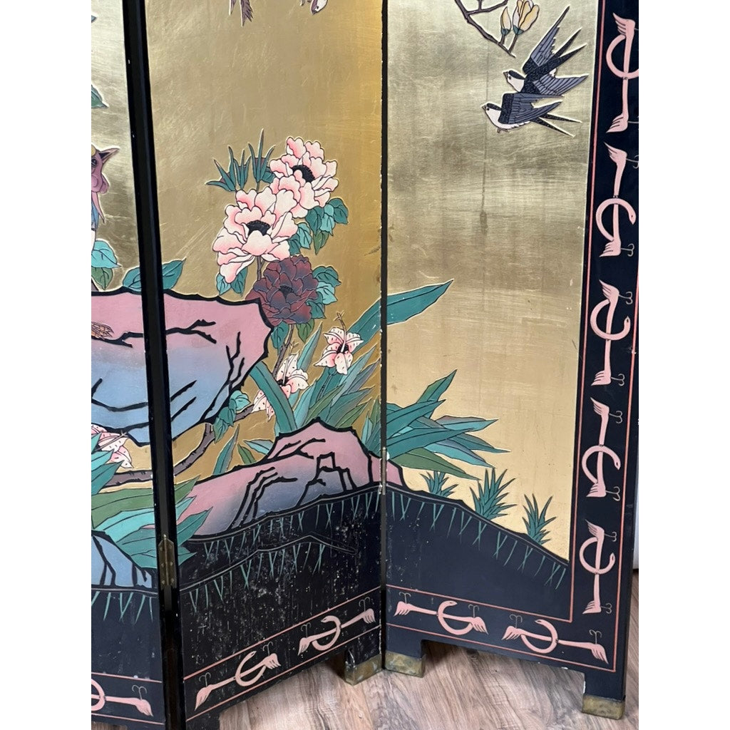 The Vintage Asian Black Lacquer Coromandel Room Screen features painted flowers, rocks, and flying birds on a gold background with a black border detailed in pink accents and patterns, making it a striking piece of decorative art.