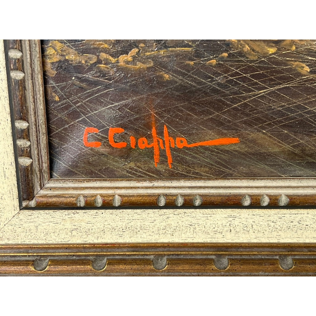 Close-up of the lower left corner of “Naples Harbor” oil painting (28 x 52), showing C. Ciappa’s signature in bright orange against a dark, textured background. Brand unknown.