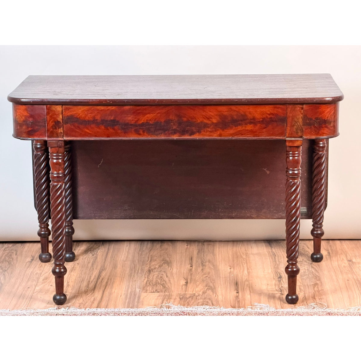 An American Classical Mahogany Single Drop-Leaf Table with spiral-twist legs, c. 1830–1845 by Pearl City Antiques, featuring a solid rectangular top and dark mahogany finish, is set on a wooden floor against a light background.