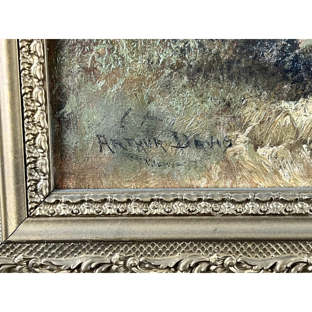 Close-up of "Spectacle Bridge," an antique early 20th century oil on canvas signed by Arthur Davis lower left, featuring a textured grassy landscape and ornate gold frame detail. Brand: Unknown.