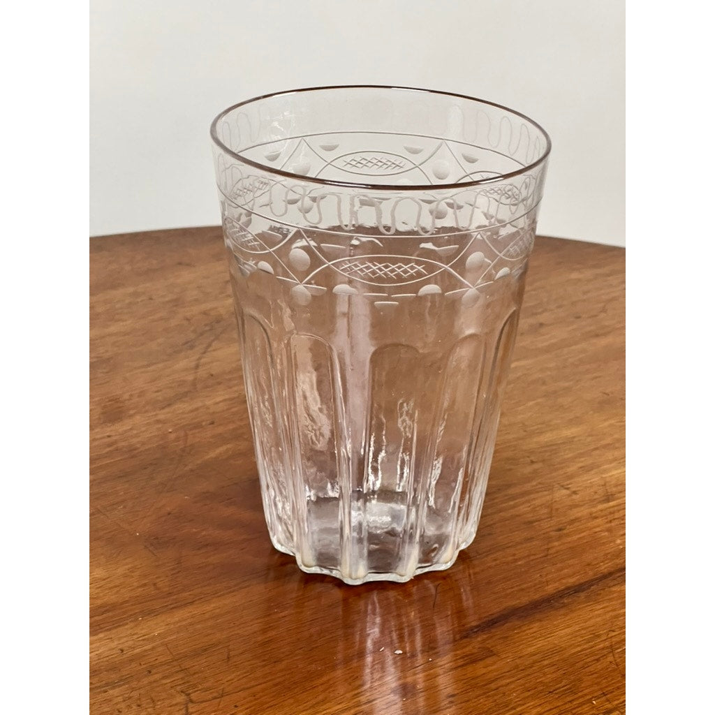 An attributed Boston & Sandwich wheel engraved mold-blown glass table vase, circa 1845–1860, stands on a brown wooden surface against a plain white background. Its intricate Victorian-era design recalls the artistry of early American glassmaking.