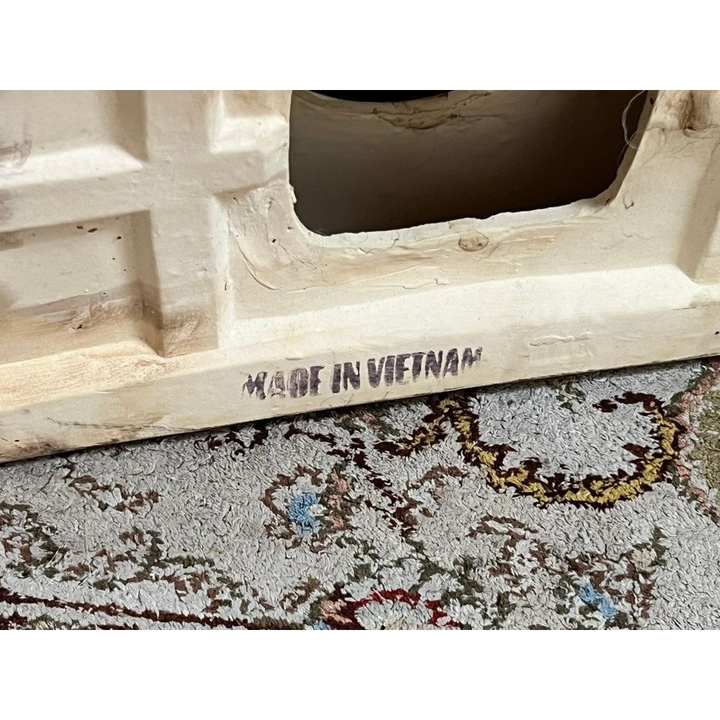 Close-up of a Vintage Pair White on White Glazed Hollywood Regency Style Elephant Garden Seats, made in Vietnam, displayed on a patterned carpet with vibrant floral and circular designs.