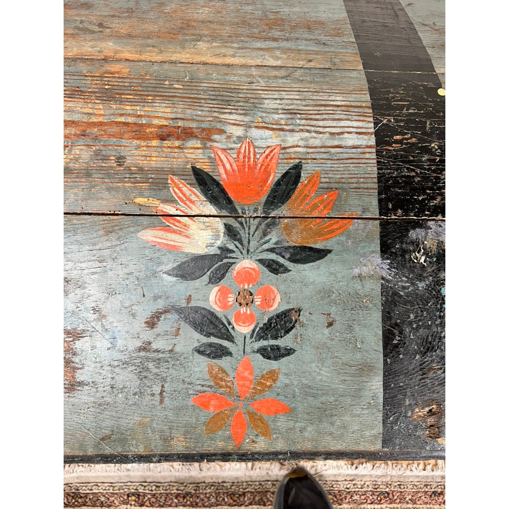 The Antique Swedish Oak Kista Dowry Chest c. 1841 features a hand-painted Swedish folk art floral design in red, orange, and green. Faded, chipped paint reveals the chest’s aged oak texture. Brand: None/Unknown.