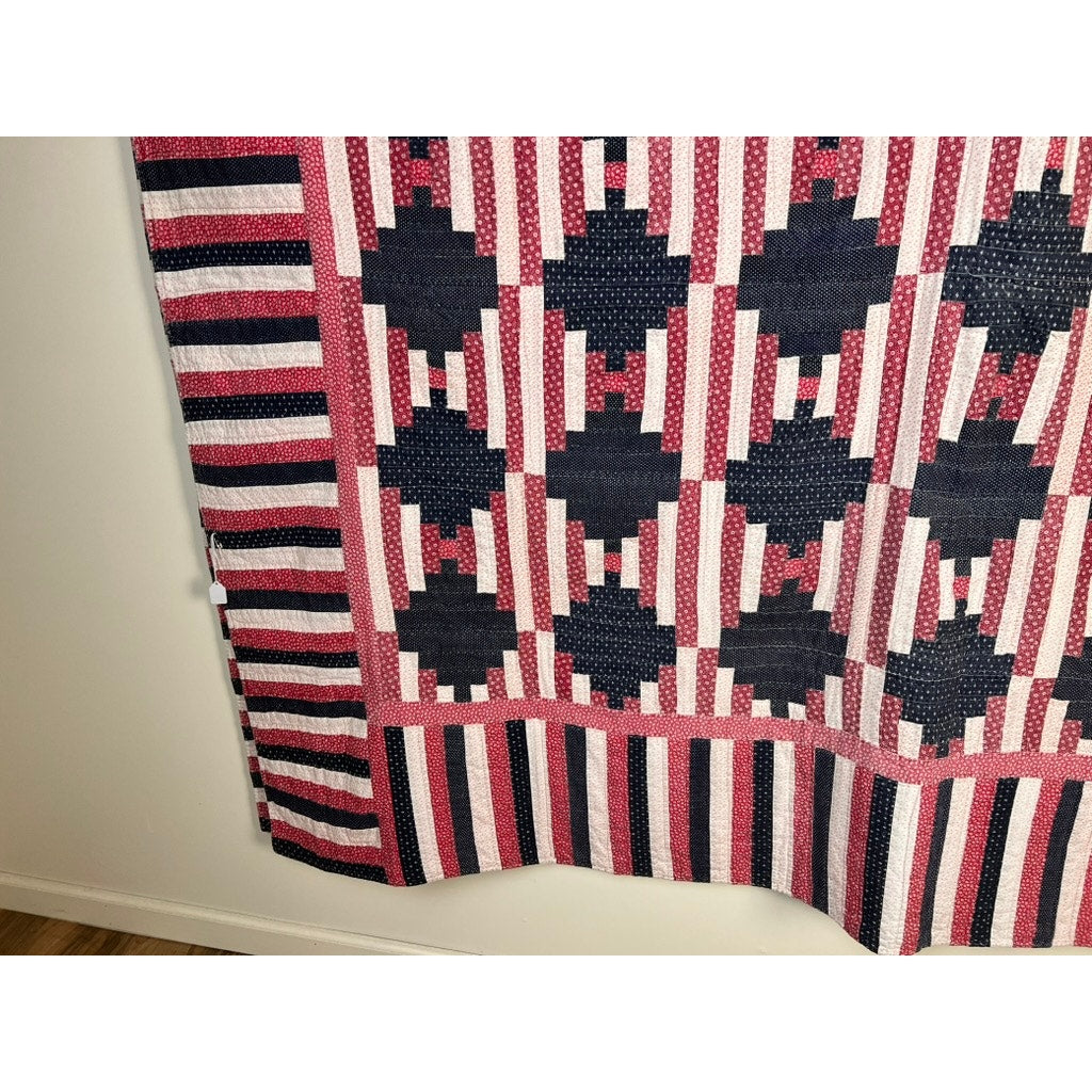 A matching pair of antique American patriotic hand-quilted Log Cabin quilts, c. early 20th century, features red, white, and blue geometric patterns with striped borders, recalling classic Americana style. Brand: None/Unknown.