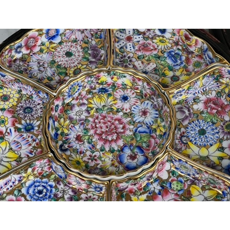 A close-up of a Vintage Chinese Canton Sweet Meat Set with Case, c. Early 20th Century, featuring an ornate porcelain dish with multiple sections, colorful floral patterns in pink, yellow, blue, green, and gold trim.