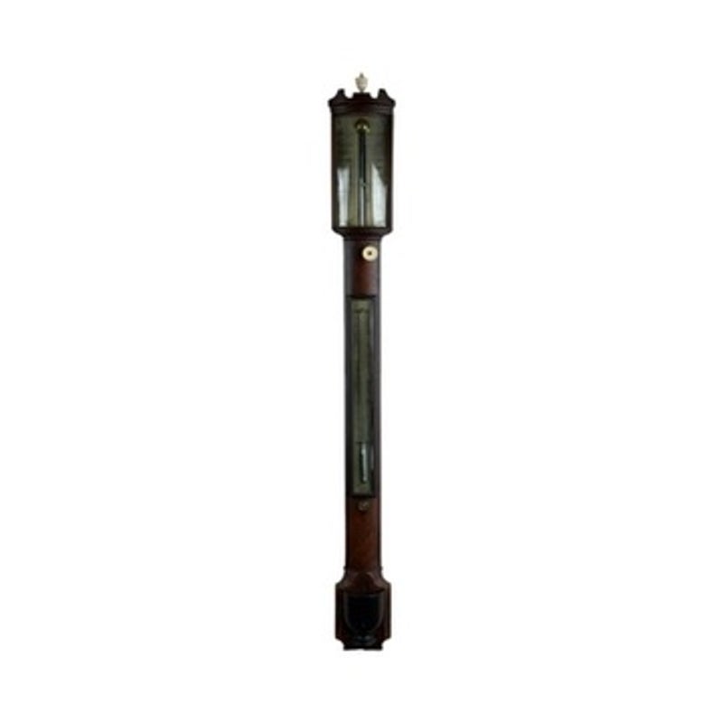 An English Regency Mahogany Stick Barometer by Thomas Jones, Liverpool, c. 1820, this antique wall-mounted scientific instrument features a glass-fronted display and a long vertical scale.