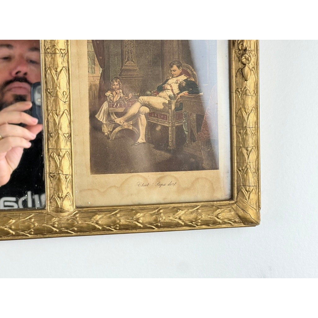 A detailed view of the Exceptional Antique Louis XV Style Three Panel Mirror flanked by images of Napoleon reveals two men in period attire indoors, with the photographer’s reflection visible on the left panel's ornate Rococo frame.