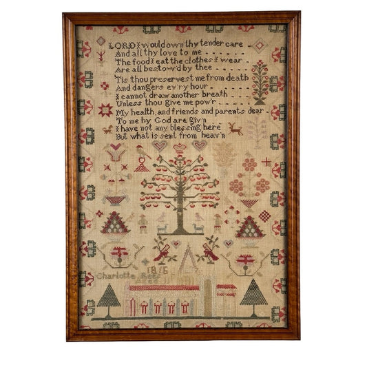 An exceptional English Regency schoolgirl needlework sampler by Charlotte Rees, age 11 and dated 1816, showcases a stitched religious verse alongside a tree, people, animals, houses, and an array of motifs in red, green, and brown thread on beige fabric. "Charlotte Rees" and the date "1816" are included near the lower left.
