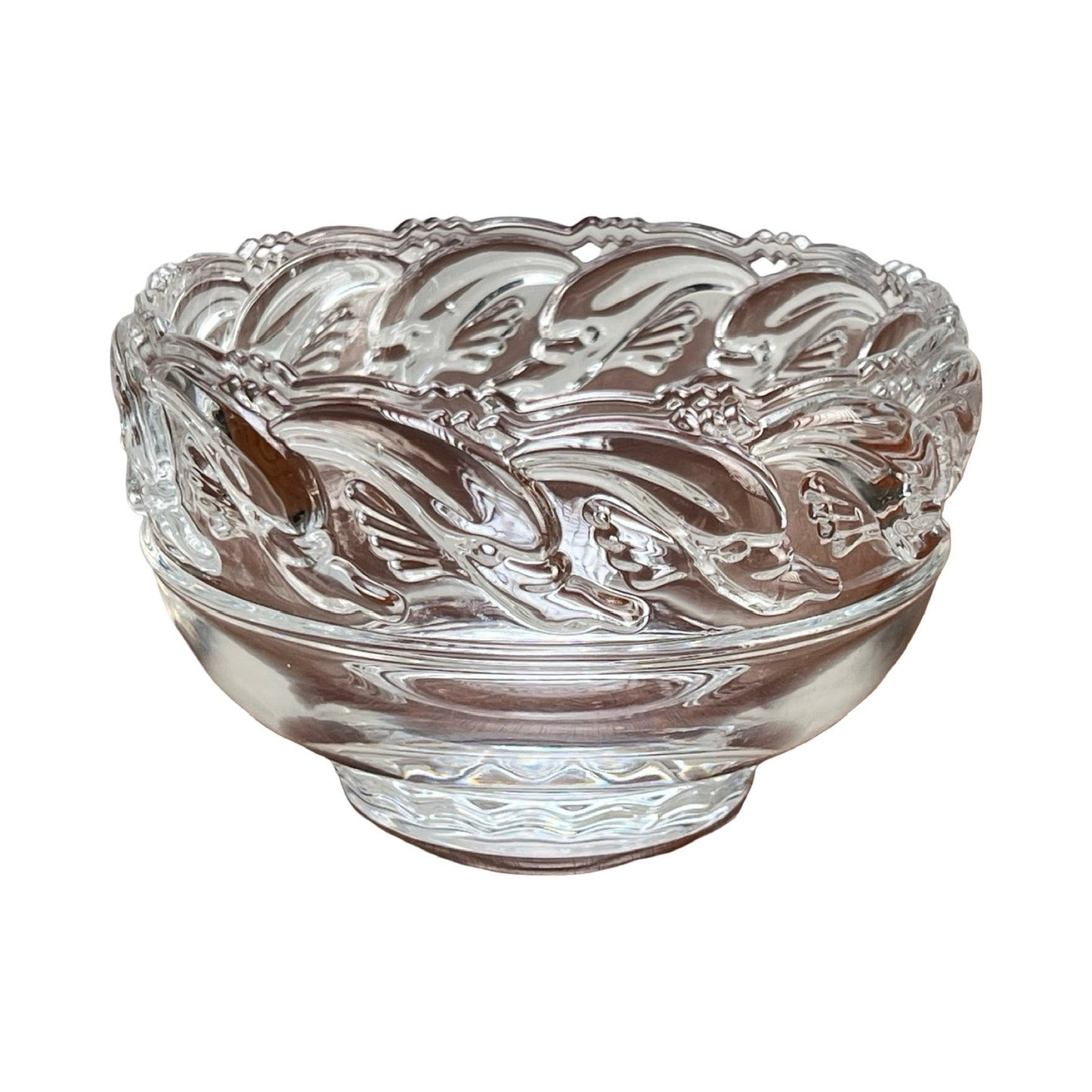 This Vintage Tiffany & Co. Mid-Century Modern Crystal Dolphin Pattern Footed Bowl features elegant embossed motifs and a smooth, rounded base, reflecting classic Tiffany & Co. craftsmanship.