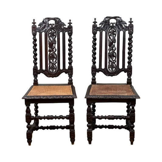 Pair Antique French Walnut Hunting Chairs, late 19th century, featuring intricately carved backs, twisted spindle legs, woven cane seats, and detailed top and backrests in classic Renaissance Revival style. Brand: Unknown.