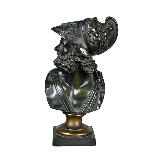 Antique Small Bronze Bust of King Menelaus (late 19th century), depicting a bearded man in an ornate helmet and toga, turned slightly left and mounted on a square base. Brand: Unknown.