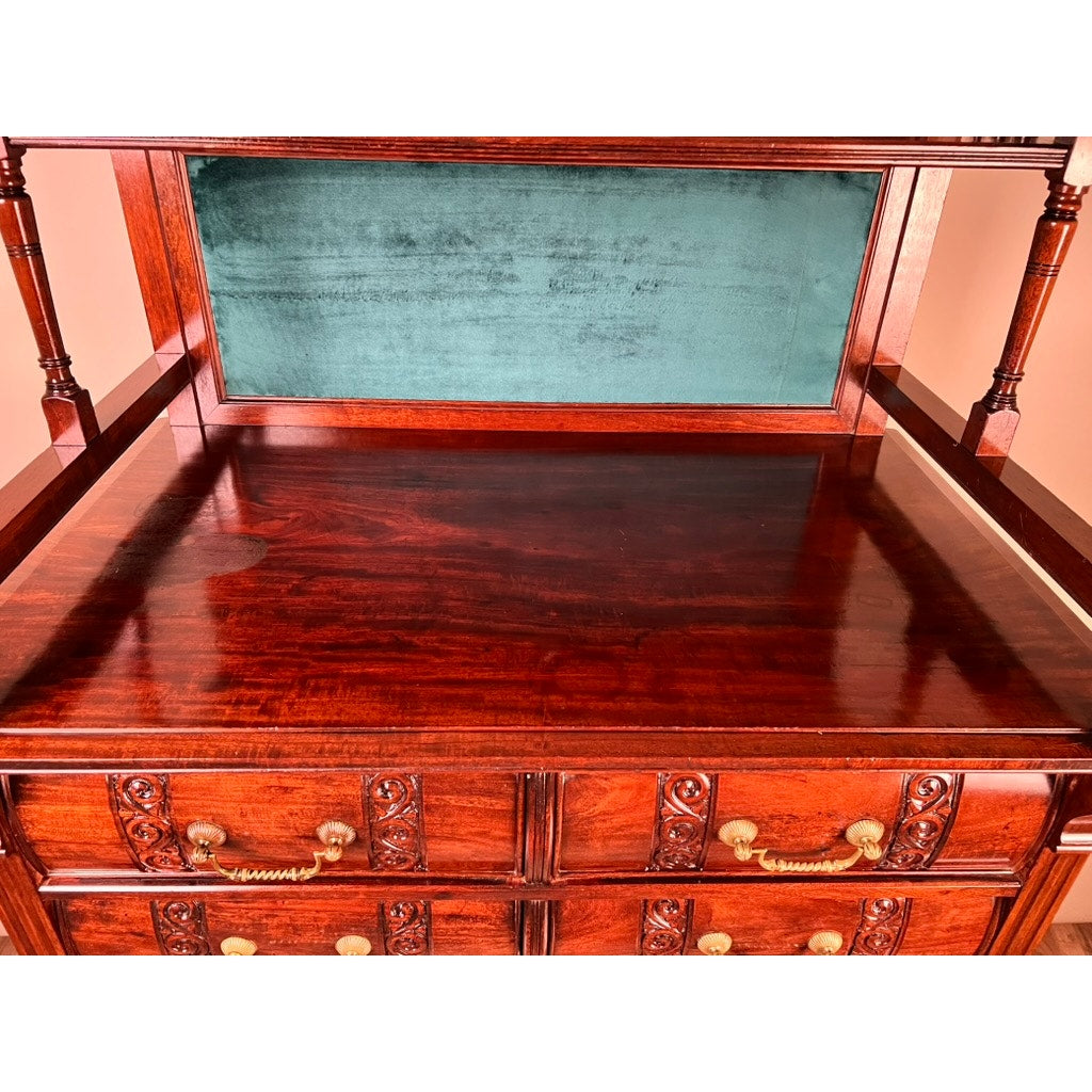 The Antique Victorian Aesthetic Movement Mahogany Four Over Four Gentlemen’s Chest c. 1880 features ornate brass handles, carved details, a green velvet-lined back panel, glossy top, and turned column shelf for classic elegance.