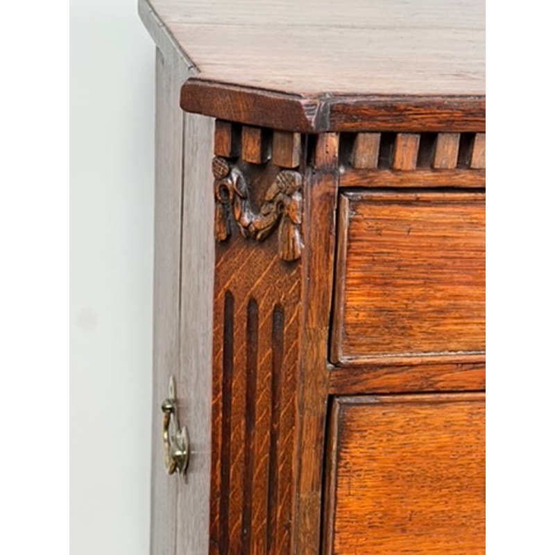 Detail of oak drawers with Louis XVI styling on late 18th century bachelors chest