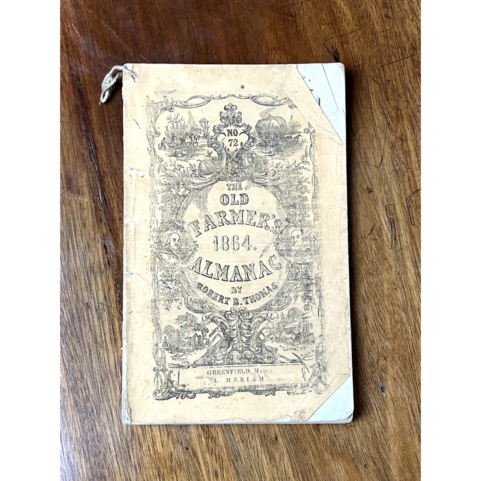 The image displays an antique set of four Old Farmer’s Almanacs—1858, 1861, 1864, and 1865—all by Robert B. Thomas, with worn covers and faded text, representing classic 19th-century American almanacs on a wooden surface.