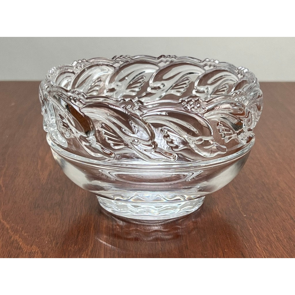 Vintage Tiffany & Co. Mid-Century Modern Crystal Dolphin Pattern Footed Bowl by Tiffany & Co., displayed on a wooden surface.
