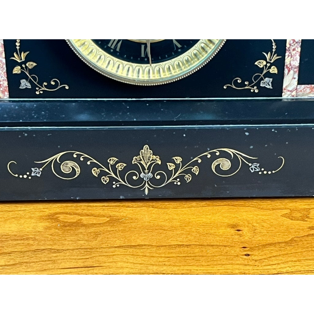 Close-up of an Antique Victorian Slate Mantle Clock with Open Escapement, 8 Day Time and Strike, c. Late 19th Century, featuring ornate gold floral and leaf designs on a black slate base, displayed on a polished wooden surface.