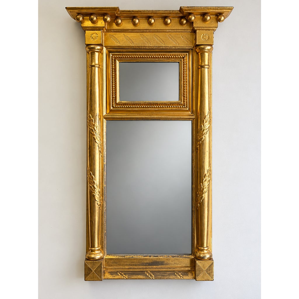 American Federal Giltwood Two-Plate Looking Glass, probably Massachusetts, circa 1810–1830: a tall, rectangular mirror with two stacked glass panes, a decorative cornice with spheres, and neoclassical column-style sides with leaf carvings.