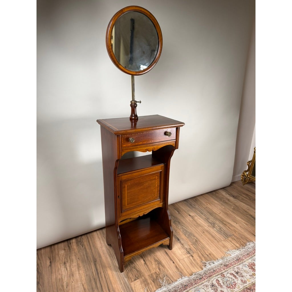 Antique English Mahogany Inlaid Shaving Stand with Adjustable Mirror, c. 1880–1900, featuring an adjustable oval mirror, single drawer, cabinet door, and open bottom shelf.