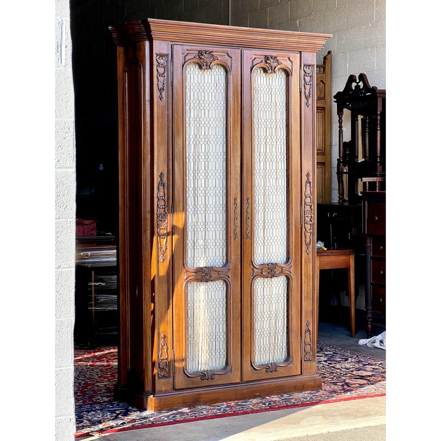 Vintage 20th Century Carved Walnut Louis XIV Style Armoire with Custom Upholstered Interior