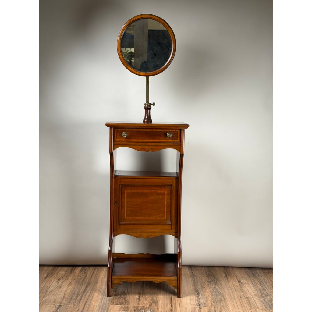 Antique English Mahogany Inlaid Shaving Stand with Adjustable Mirror, c. 1880–1900, featuring a central drawer, a cabinet door, an open bottom shelf, and an adjustable circular mirror on a pedestal mount.