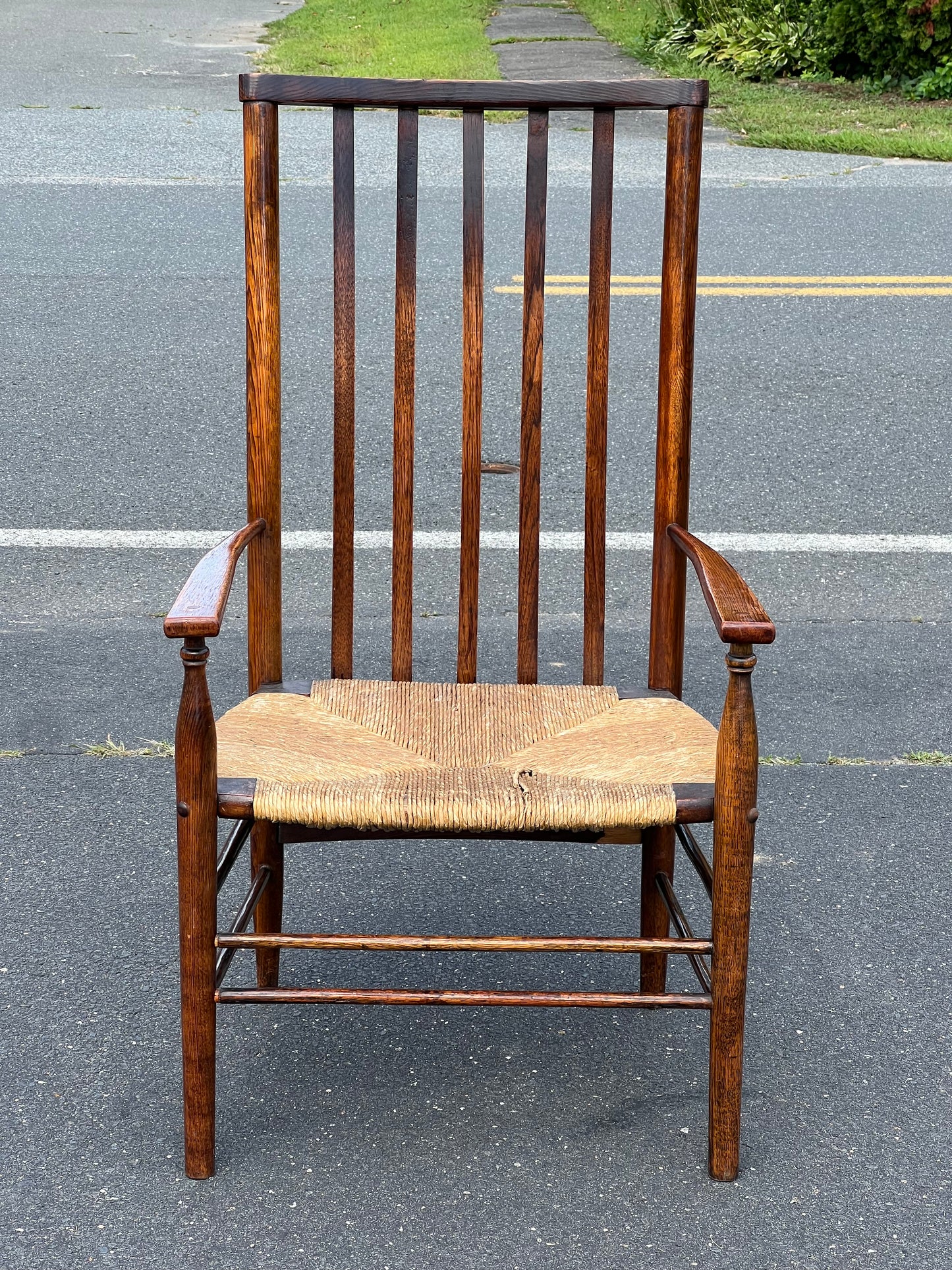 Antique Edwardian Oak Elbow Chair with Rush Seat c. 1910