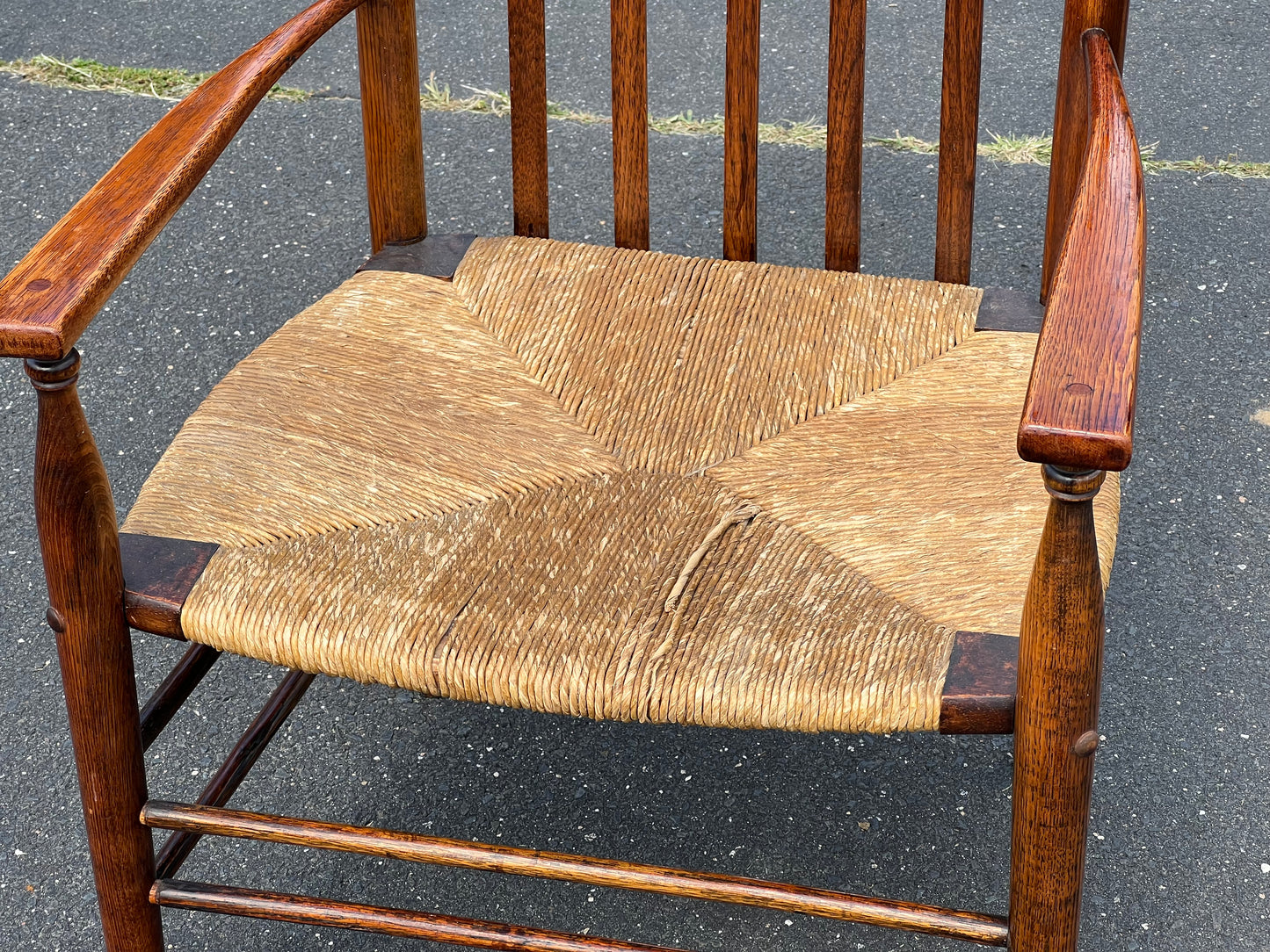 Antique Edwardian Oak Elbow Chair with Rush Seat c. 1910