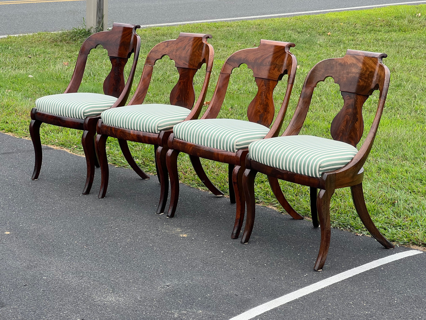 Antique Suite of Four Saber Leg Flame Mahogany Chairs c. 1830