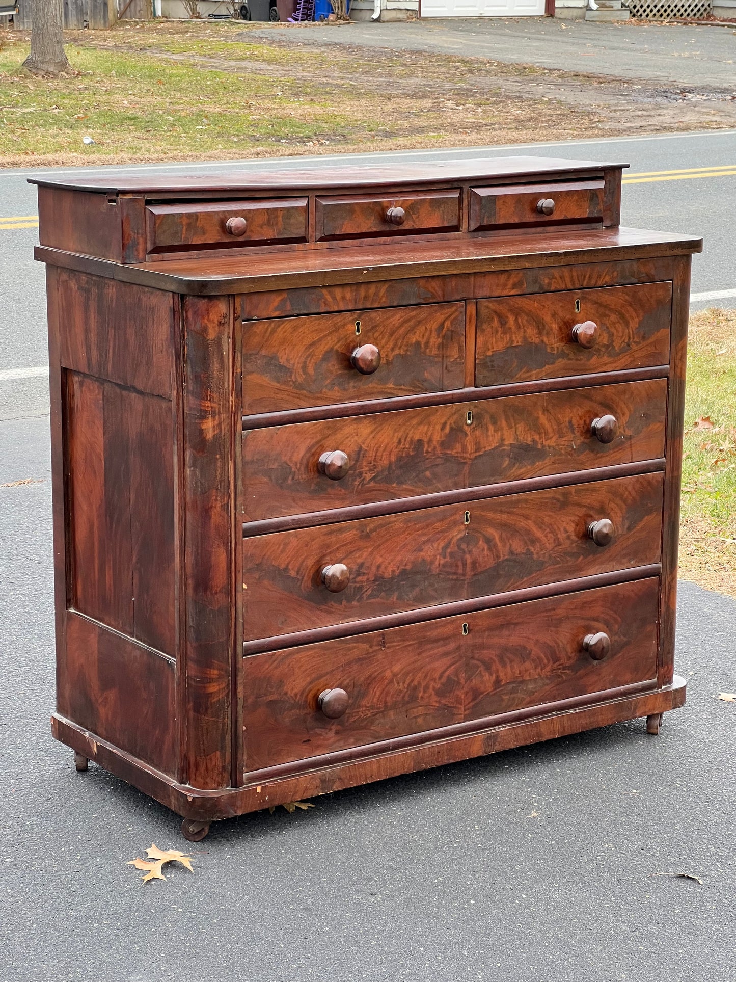 Antique American Empire Flame Mahogany Two Over Three Chest of Drawers from the 1830s