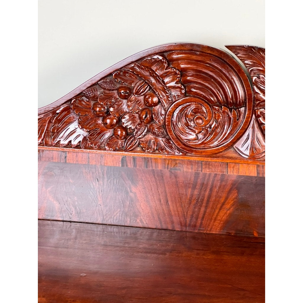 Close-up of the Antique American Empire Mahogany Sideboard with rosewood edge banding, featuring a polished finish and intricate patterns reminiscent of Philadelphia craftsmanship, c. 1840. Brand: None/Unknown.