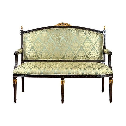 A Vintage Louis XVI Style Settee in green damask upholstery features ornate carvings, a floral pattern, and gold-accented frame and legs; brand: unknown.
