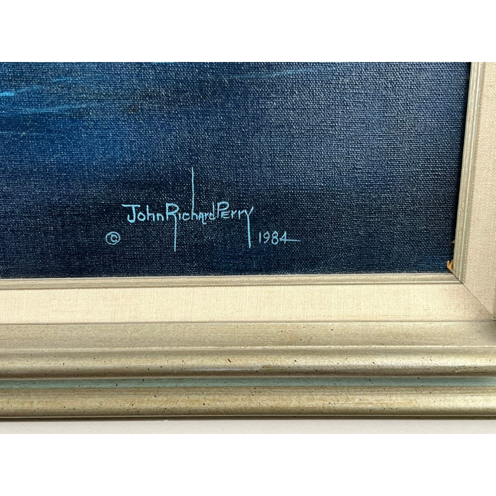 Close-up of “Barque Archibald Russell 1905” oil on canvas painting by John Richard Perry ME, showing the artist’s light blue signature and year “1984” at the lower right on a dark background, finished with a beige frame.