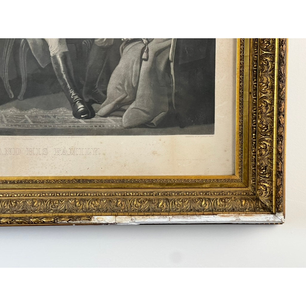 Close-up of an ornate period gilt frame corner with part of the black and white “Washington and His Family” engraving (published by Bradley & Co., Philadelphia, 1858) visible inside. Some wear and chipping can be seen along the lower edge of the antique frame.