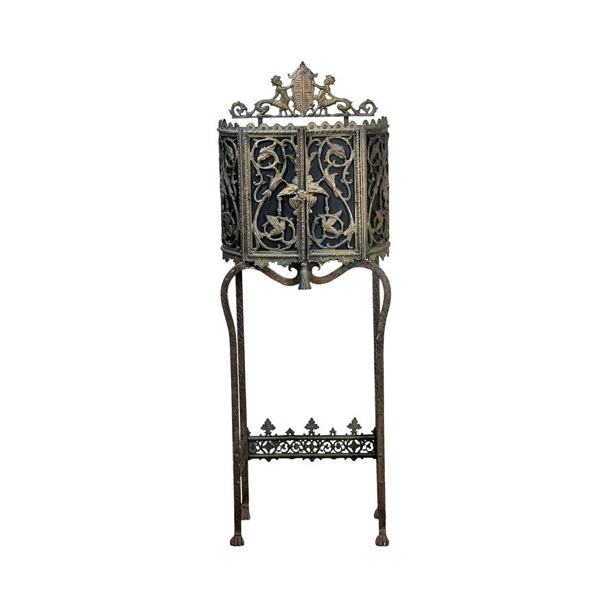 Antique Gothic Revival cast iron and brass phone stand attributed to Oscar Bach or Bertram Segar, c. 1920 Greenwich Village, featuring decorative scrollwork and crest in ornate filigree design. Brand: None/Unknown.