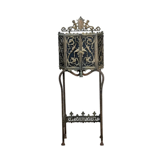 Antique Gothic Revival cast iron and brass phone stand attributed to Oscar Bach or Bertram Segar, c. 1920 Greenwich Village, featuring decorative scrollwork and crest in ornate filigree design. Brand: None/Unknown.
