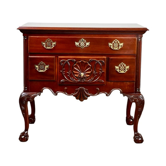 Vintage Solid Mahogany Chippendale Style Lowboy by Councill Craftsmen, featuring ornate brass handles, carved details, clawfoot legs, three drawers, and a polished dark wood finish.