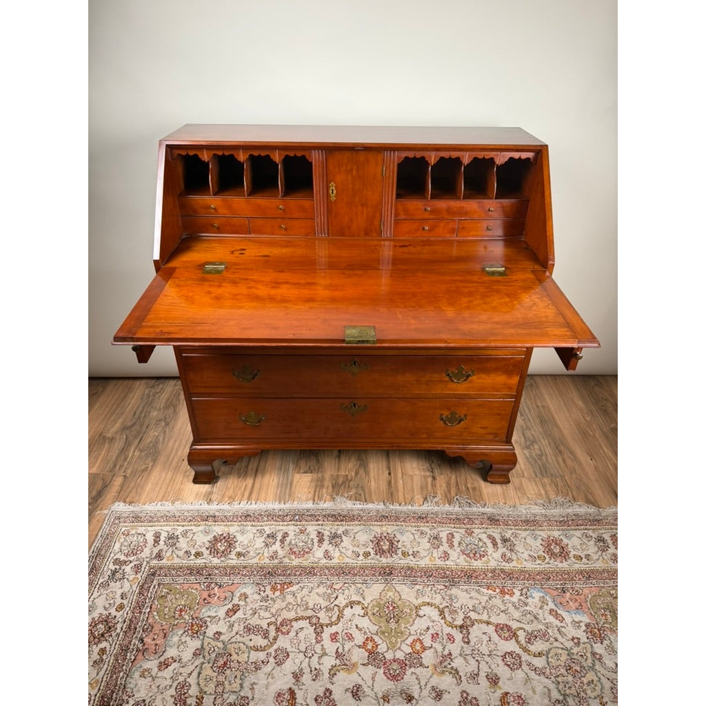 Chippendale Cherry Slant-Front Desk with Ogee Bracket Feet, possibly Connecticut River Valley, circa 1770–1790, an 18th-century cherry wood desk with a drop-down writing surface, two lower drawers, and interior pigeonhole compartments.