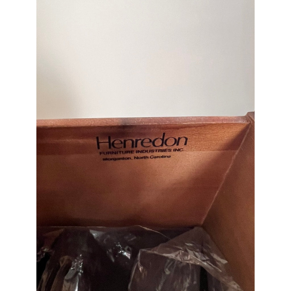 The interior of the Vintage Solid Cherry Queen Anne Style Sideboard by Henredon features the Henredon logo stamped above clear plastic wrapping.