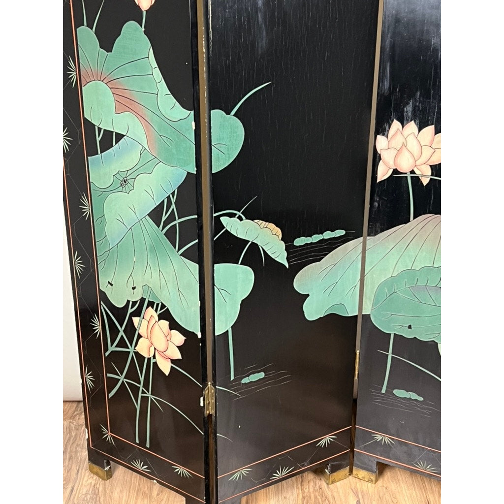 The Vintage Asian Black Lacquer Coromandel Room Screen features a black lacquer finish with painted green lotus leaves and pale pink blossoms—an elegant example of Chinese decorative art, ideal for display on any wood floor.