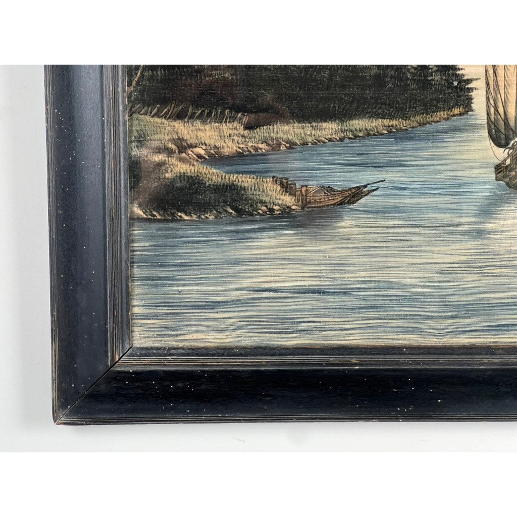 A close-up of the Japanese Meiji Period Embroidered Painting attr. to Nishimura Sozaemon of Kyoto reveals a calm river, wooden boat by the shore, grassy banks, and trees, all in a dark wood frame that enhances its timeless beauty.