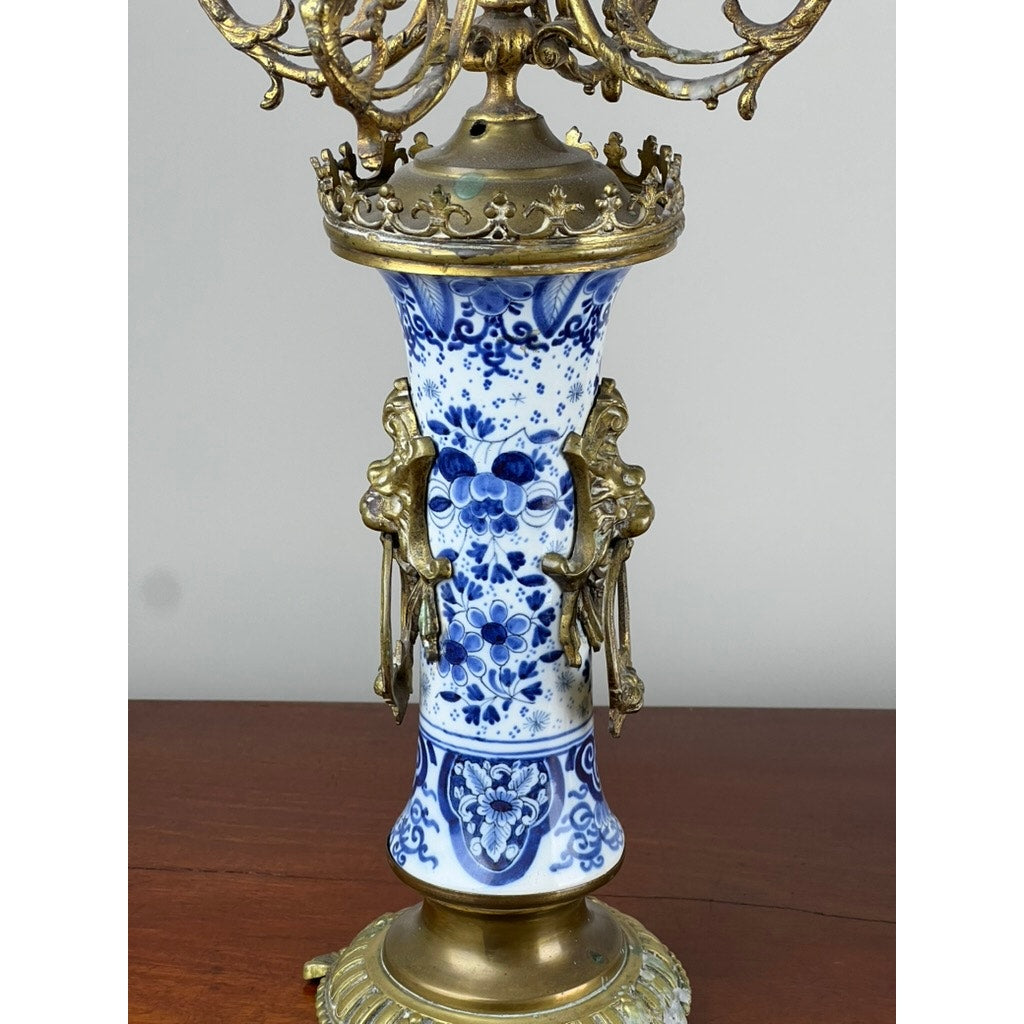 Detail of blue and white Delft decoration on antique candelabra base