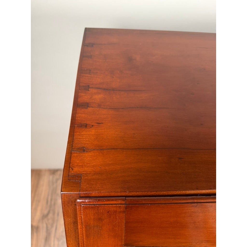 Close-up corner of a Chippendale Cherry Slant-Front Desk with Ogee Bracket Feet, Possibly Connecticut River Valley, circa 1770–1790, showing exposed dovetail joinery along the top edge.