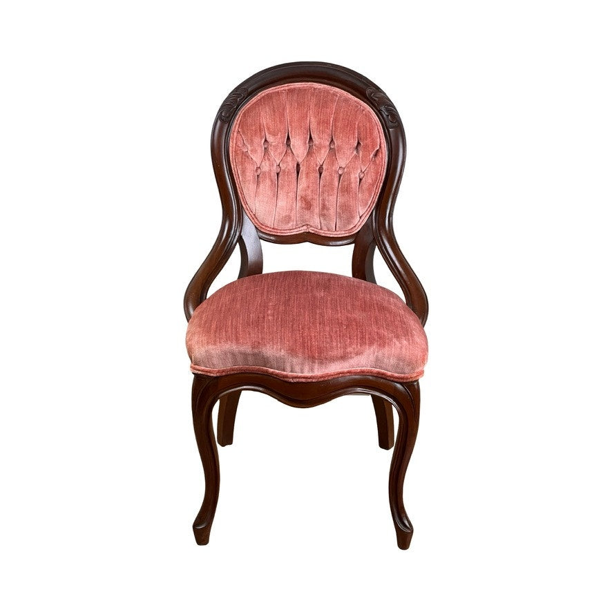 An Antique Victorian Walnut Tufted Balloon Back Side Chair (late 19th century) with curved legs, armrests, and a plush pink tufted seat and backrest, displayed against a white background. Brand: Unknown.