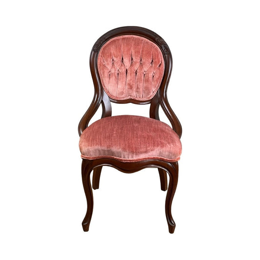 An Antique Victorian Walnut Tufted Balloon Back Side Chair (late 19th century) with curved legs, armrests, and a plush pink tufted seat and backrest, displayed against a white background. Brand: Unknown.