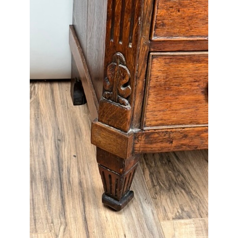 Detail of oak drawers with Louis XVI styling on late 18th century bachelors chest